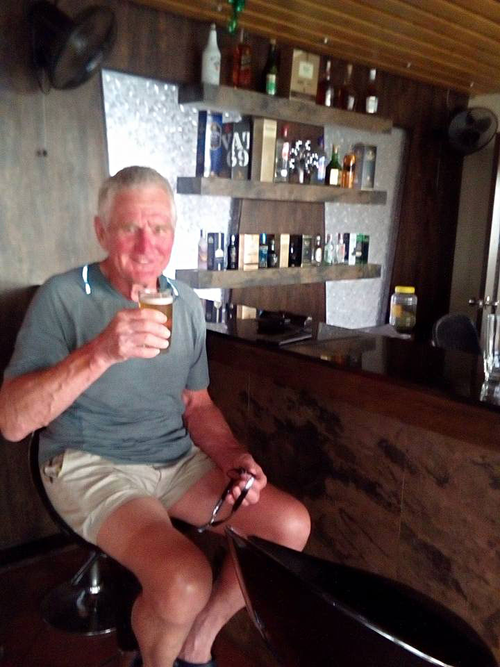 Veteran French cyclist enjoying beer at Hotel Alankar Devgad
